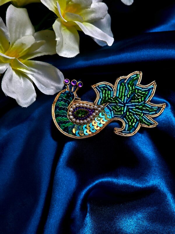 Peacock design saree pin with colorful detailing for traditional wear