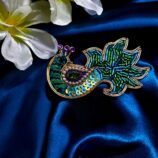 Peacock design saree pin with colorful detailing for traditional wear