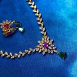 Elegant hanging gem jewellery set with necklace and matching earrings