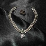 White stone jewellery set with necklace and matching earrings