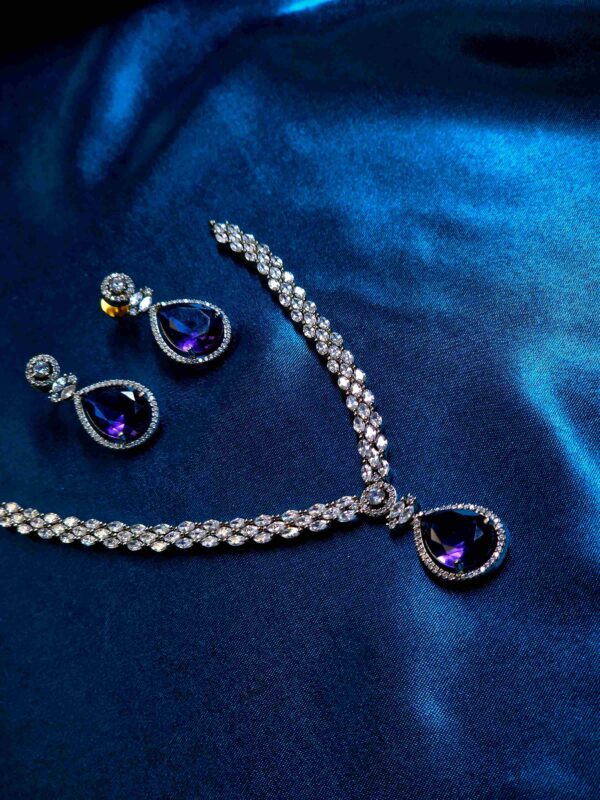 Purple gemstone jewelry set with necklace and matching earrings